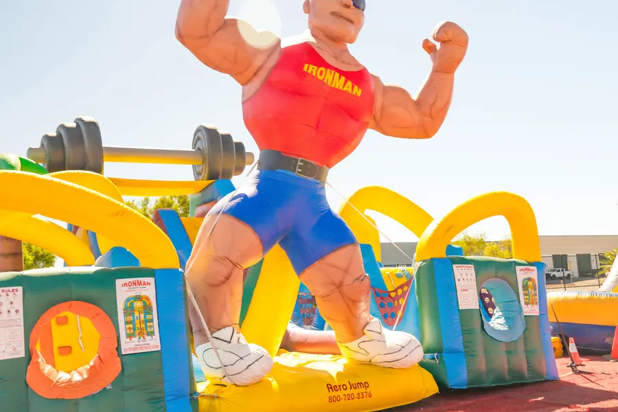 A giant inflatable strongman obstacle course in the kids zone