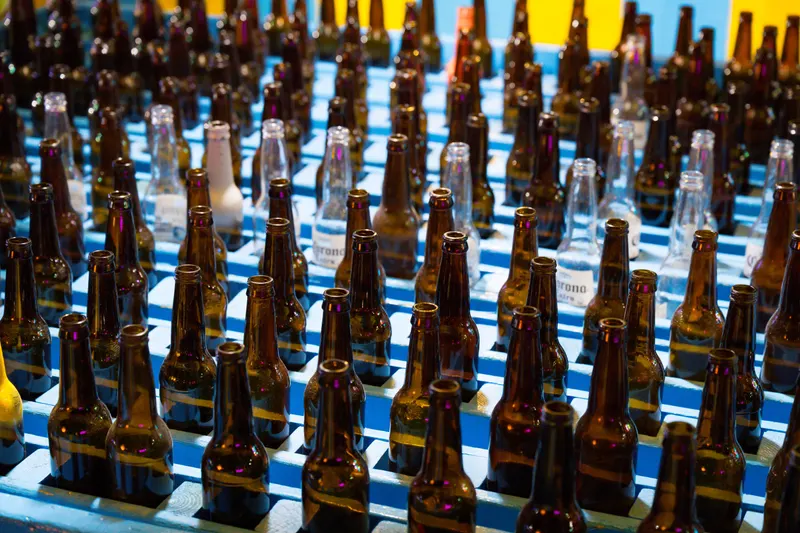 Rows of glass bottles waiting for the ring toss