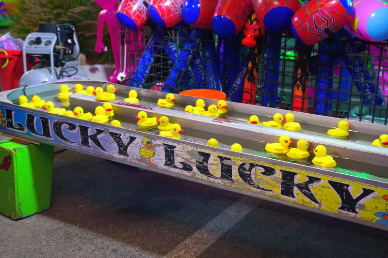 The Lucky Lucky rubber-duck game with a wall of prizes behind it